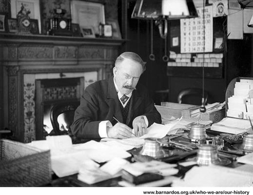  Dr Thomas Barnardo at his desk