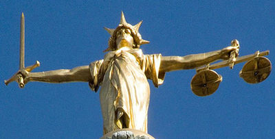 The statue of Justice on top of the Old Bailey